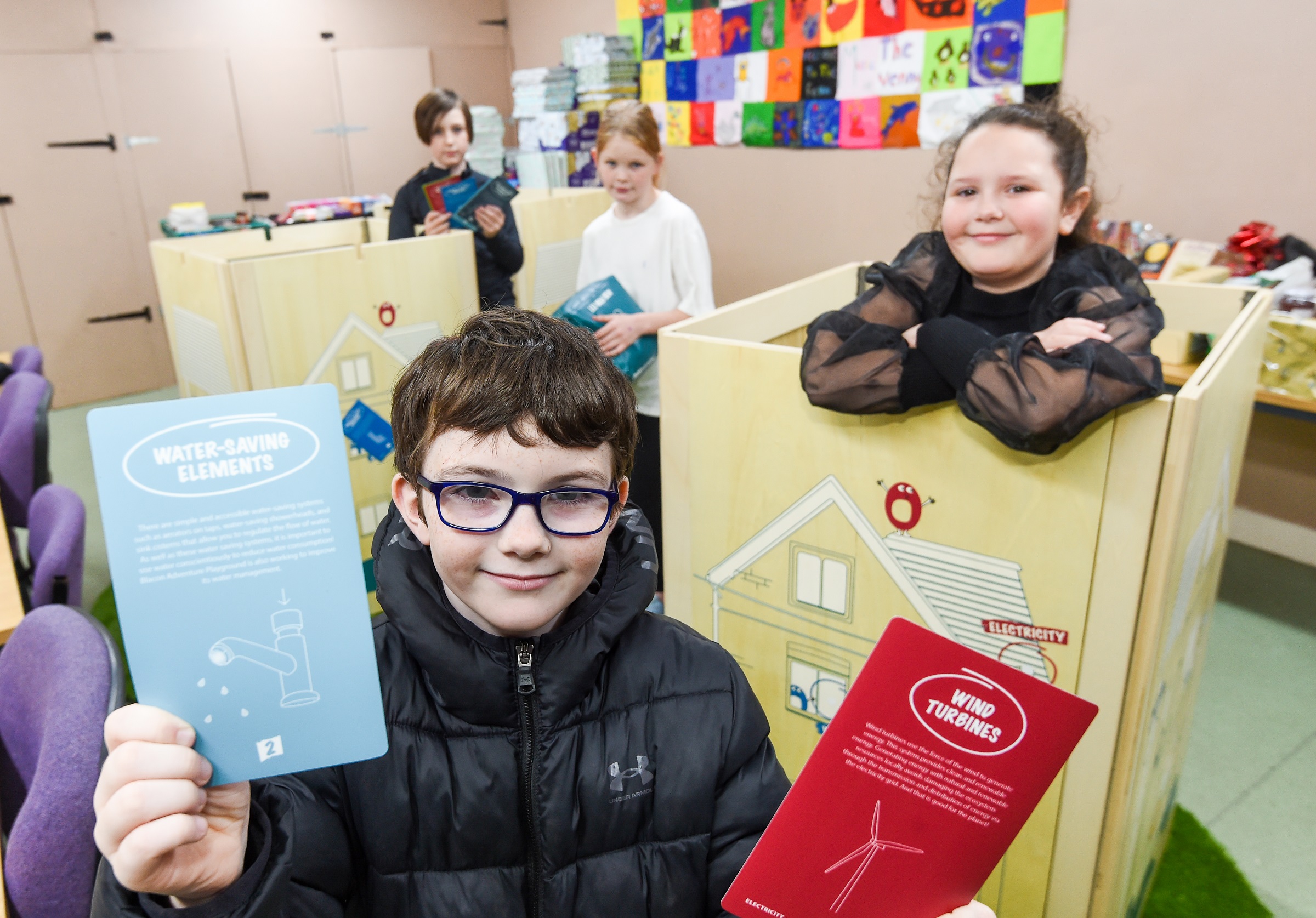Picture showing children using the new educational materials at Blacon Adventure Playground.