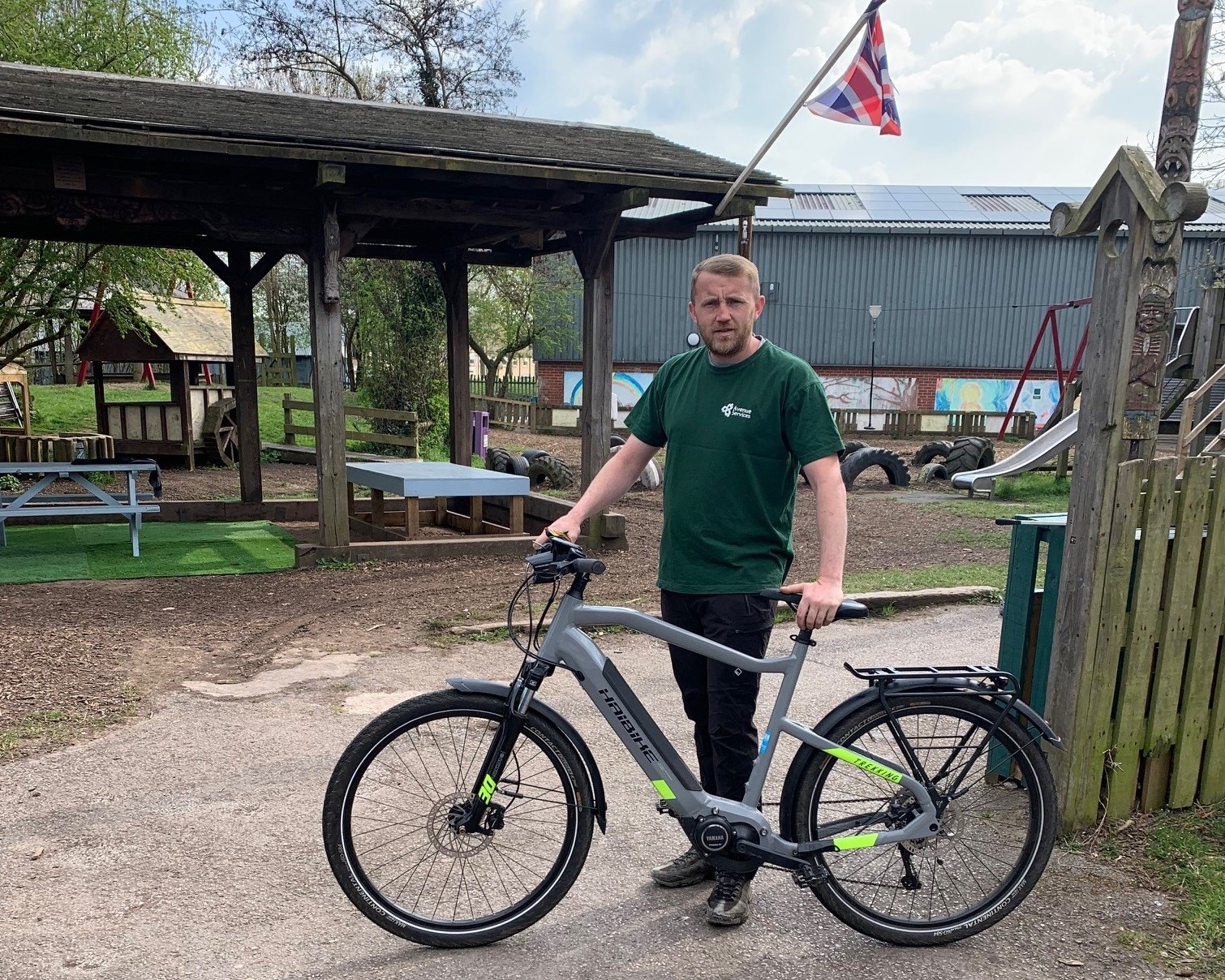 Image showing Blacon Adventure Playground play worker Liam Evans with his new electric bike.